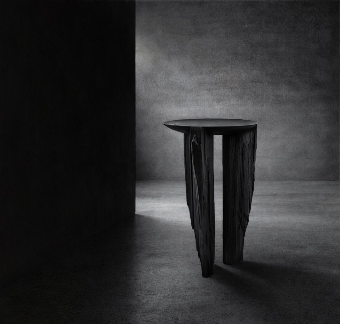 Ebonized reclaimed timber table with fractured wood supports by sculptor Isac Elam Kaid