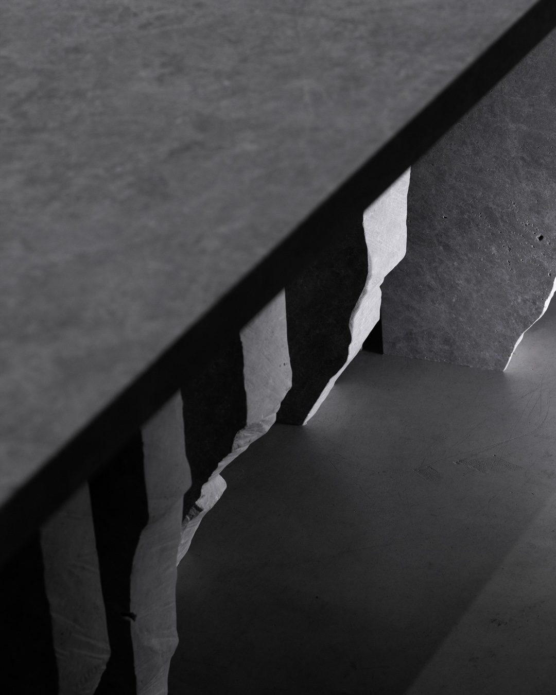 Fractured Grey Tundra marble stone table with vertical shard supports by Isac Elam Kaid